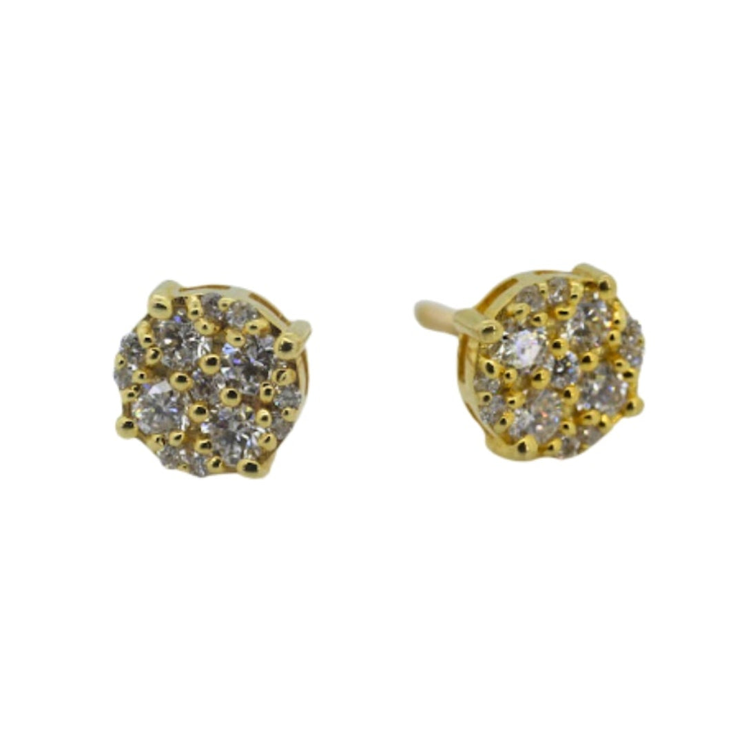 Gold earrings with gemstones on a white background