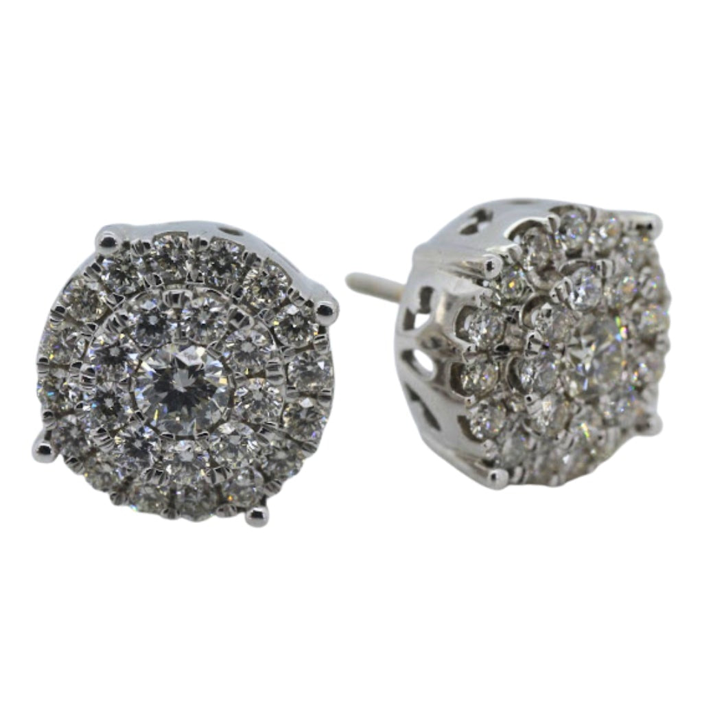 Pair of silver earrings with gemstones on a white background