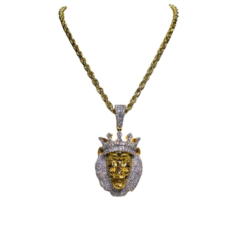 Gold necklace with a lion head pendant on a white background