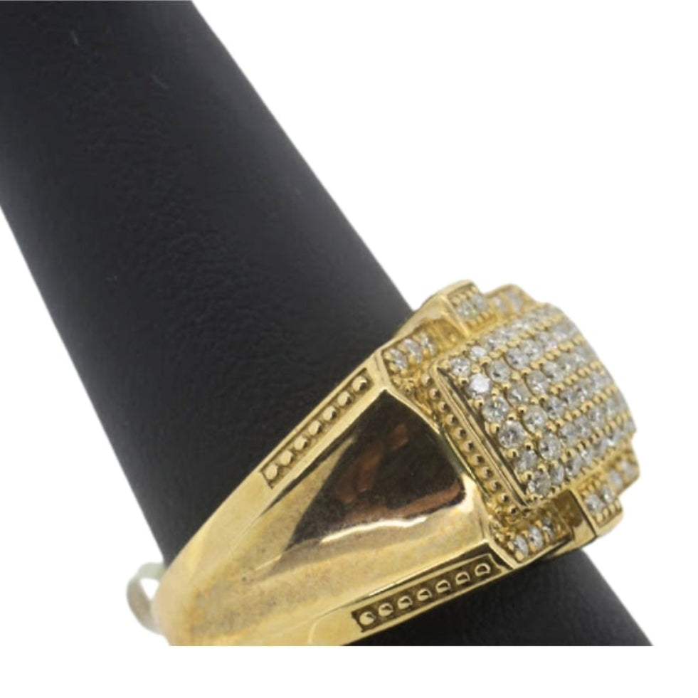 Gold ring with gemstones on a black stand against a white background