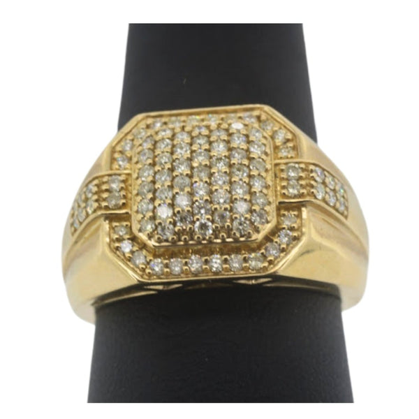 Gold ring with diamond accents on a black stand against a white background
