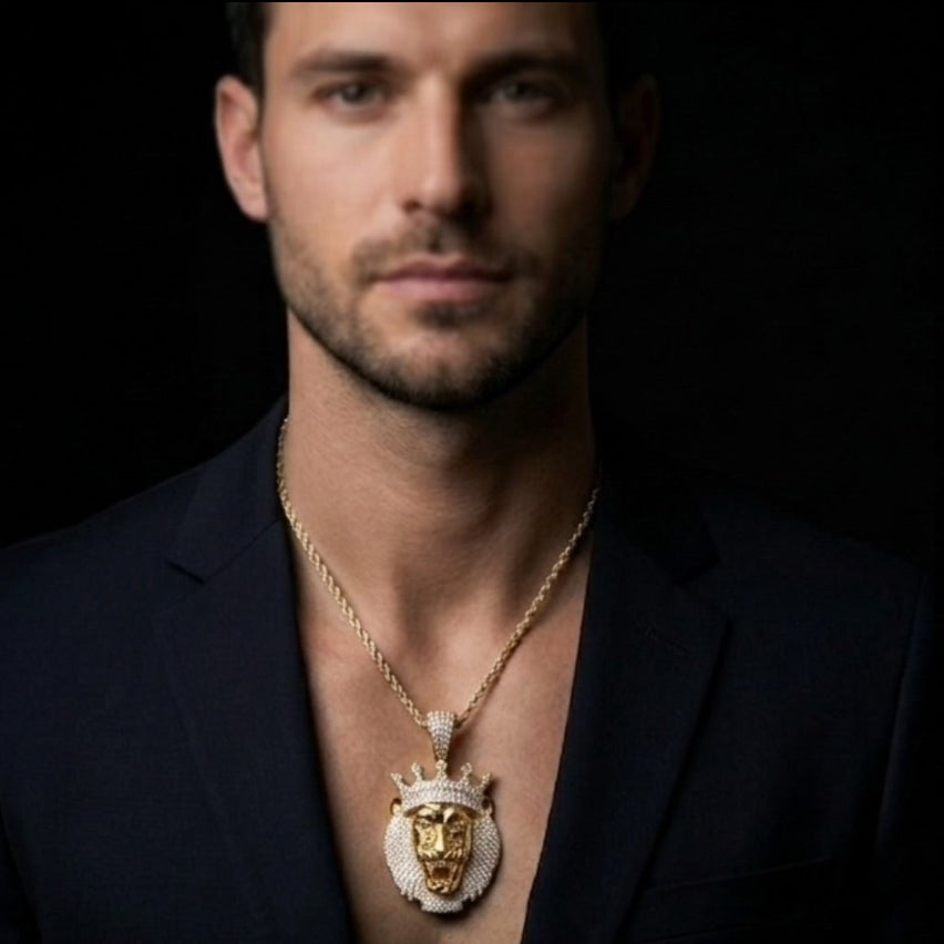 Man and woman wearing butterfly necklaces against a dark background